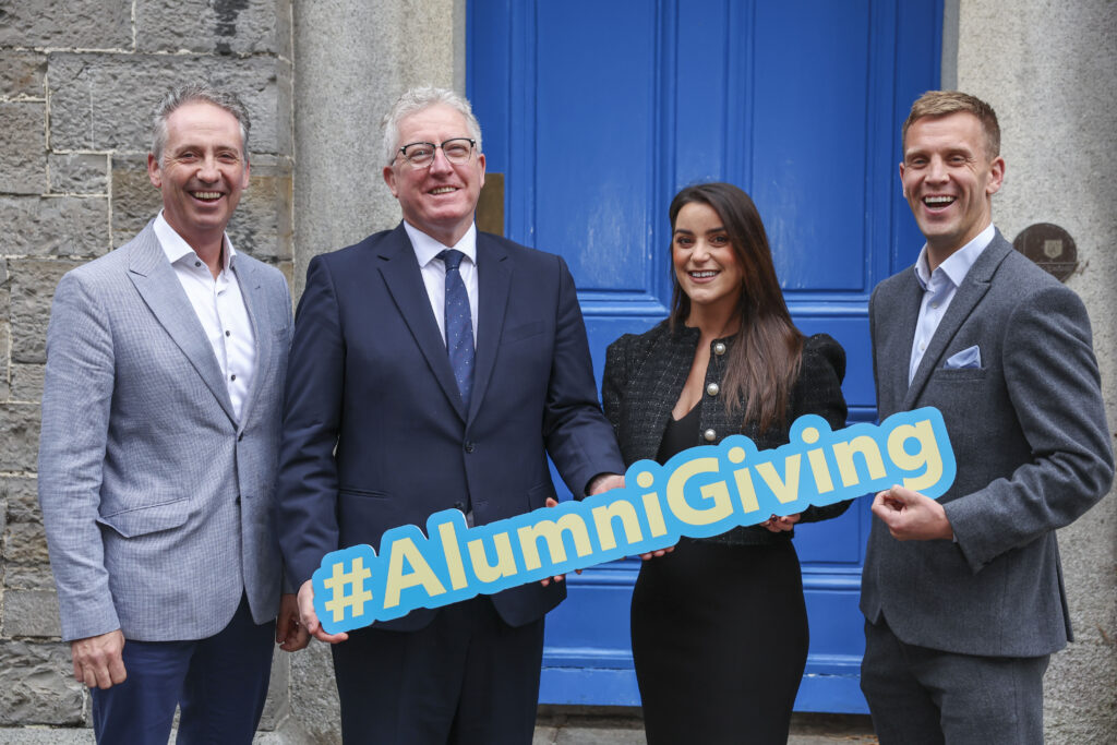 Three DCU graduates with DCU President Prof Dáire Keogh